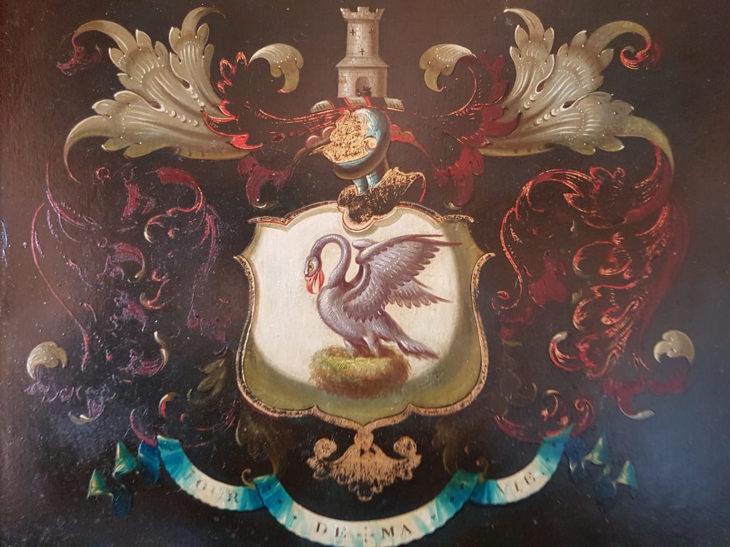 British noble crest with a swan and motto